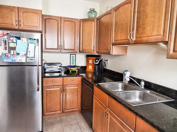 Kitchen with Stainless Steel Appliances at Integrity Gold Coast Apartments in Lakewood, Ohio, 44102